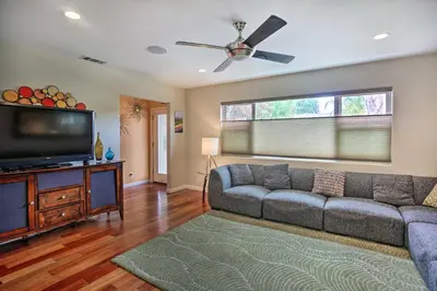 a living room with a couch and a flat screen tv at Updated San Diego Home with Private Yard and Patio! in San Diego