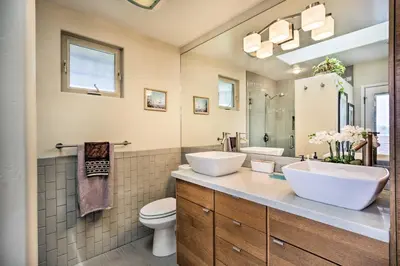 a bathroom with two sinks and a toilet at Updated San Diego Home with Private Yard and Patio! in San Diego