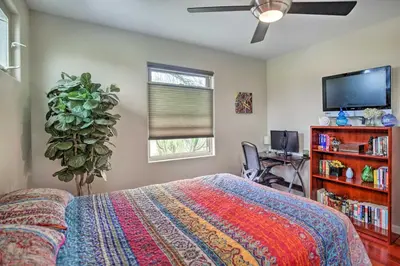 a bedroom with a bed and a flat screen tv at Updated San Diego Home with Private Yard and Patio! in San Diego