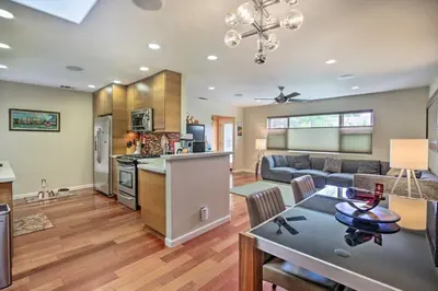 a kitchen and living room with a couch and a table at Updated San Diego Home with Private Yard and Patio! in San Diego