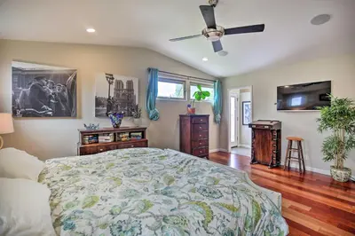 a bedroom with a bed and a ceiling fan at Updated San Diego Home with Private Yard and Patio! in San Diego