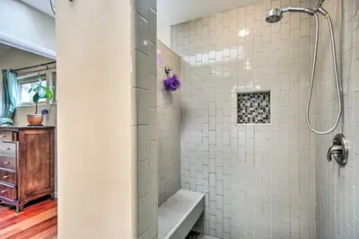 a bathroom with a shower with white tiles at Updated San Diego Home with Private Yard and Patio! in San Diego