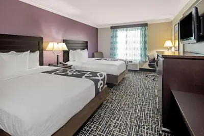 a hotel room with two beds and a television at La Quinta by Wyndham Temecula in Temecula