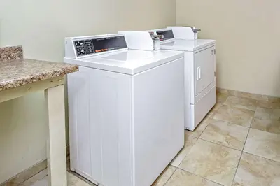 a washing machine and a washer and dryer in a room at La Quinta by Wyndham Temecula in Temecula
