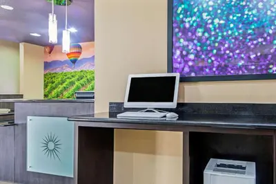 a laptop computer sitting on top of a desk at La Quinta by Wyndham Temecula in Temecula