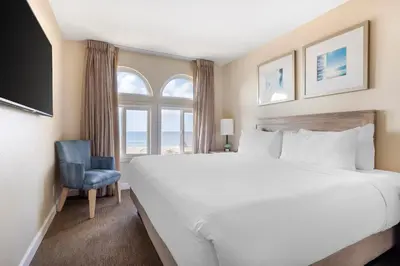 a bedroom with a large bed and a window at Hilton Vacation Club Riviera Beach & Shores in Capistrano Beach