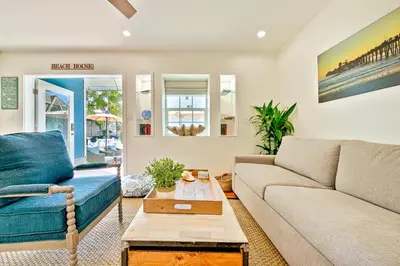 a living room with a couch and a table at Mission Beach Getaway in San Diego