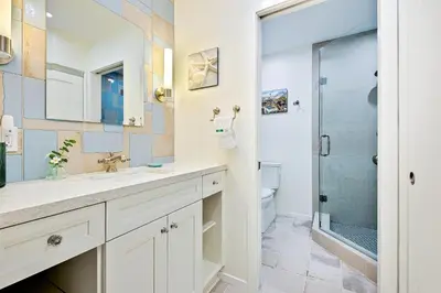 a bathroom with a sink and a shower at Mission Beach Getaway in San Diego