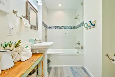 a bathroom with a tub and a sink and a shower at Mission Beach Getaway in San Diego