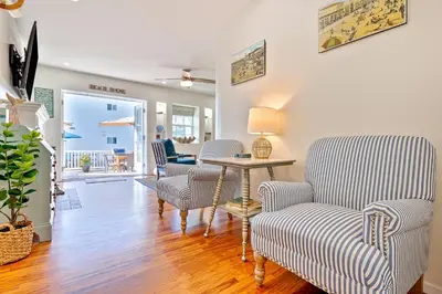a living room with two chairs and a table at Mission Beach Getaway in San Diego