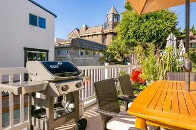 a grill sitting on a patio with a table at Mission Beach Getaway in San Diego
