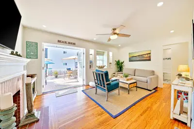a living room with a couch and a fireplace at Mission Beach Getaway in San Diego