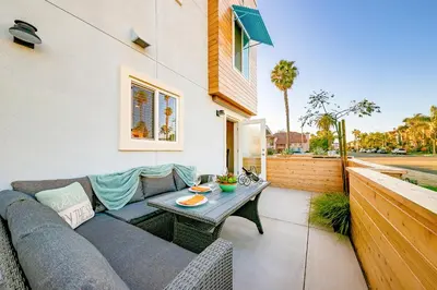 a patio with a couch and a table at New Tremont Modern Beach in Oceanside