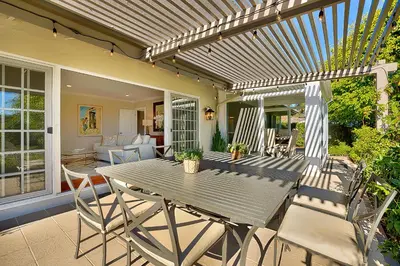 a patio with a table and chairs on a porch at La Jolla Scenic Retreat in San Diego
