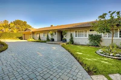 a house with a brick driveway in front of it at La Jolla Scenic Retreat in San Diego