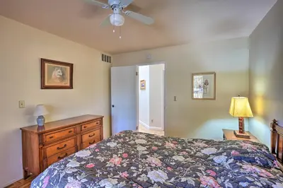 a bedroom with a bed and a dresser and a ceiling fan at Borrego Springs Getaway with Private Pool and Views! in Borrego Springs