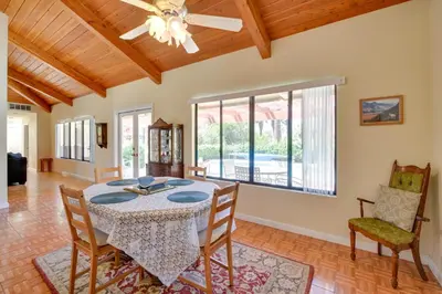a dining room with a table and chairs and a ceiling fan at Borrego Springs Getaway with Private Pool and Views! in Borrego Springs