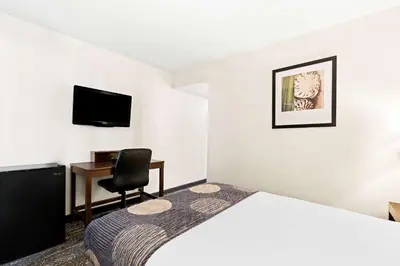 a hotel room with a bed and a desk at Best Western Yacht Harbor Hotel in San Diego