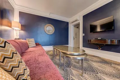 a living room with a couch and a table at Inn at the Park in San Diego