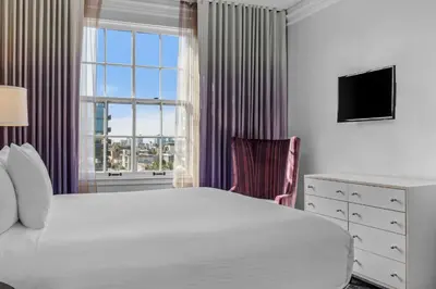 a bedroom with a large bed and a window at Inn at the Park in San Diego