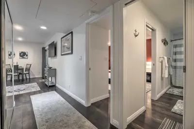 a living room with a hallway with a dining room at Contemporary San Diego Gem with Community Pool! in San Diego