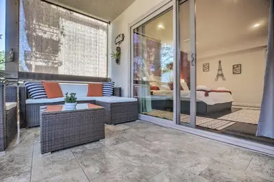 a balcony with a couch and a bed in a room at Contemporary San Diego Gem with Community Pool! in San Diego