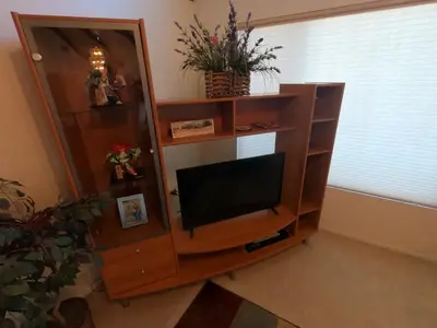 a entertainment center with a television in a living room at Sommer Hus-Best value in Southern California Wine Country in Temecula