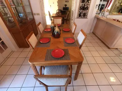 a wooden table with red plates on top of it at Sommer Hus-Best value in Southern California Wine Country in Temecula