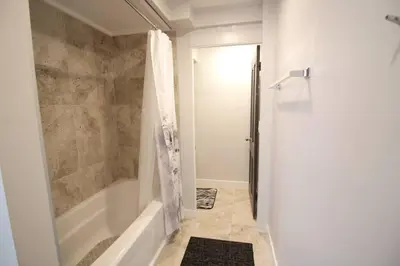 a bathroom with a shower and a bath tub at Spacious Guest Suite Amazing Location in San Diego