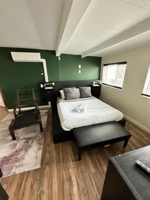 a room with a bed and a chair in it at Special Studio in Center of San Diego in San Diego