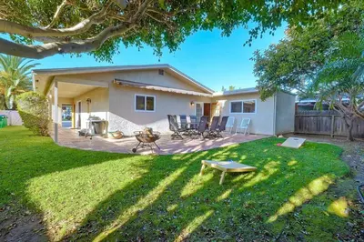 a house with a yard with a fire pit at Great Group Retreat! Hacienda Decor, Spacious Floor Plan, Private Backyard in Carlsbad