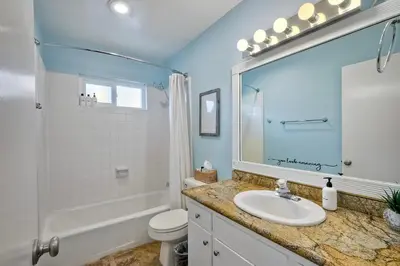 a bathroom with a sink and a toilet and a shower at 90 Walk Score - Steps to Beach & Dining - Reserved Parking in Carlsbad