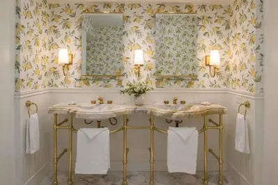 a bathroom with a sink and two mirrors at The Inn at Rancho Santa Fe in Rancho Santa Fe