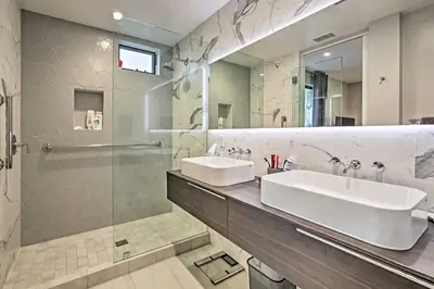 a bathroom with two sinks and a shower at Chic Coronado Retreat with Patio and 4 Cruiser Bikes! in San Diego