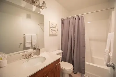 a bathroom with a sink and a toilet and a shower at Huge Oceanside Private 2BR Apartment-Pool-Gym-Spa in Oceanside