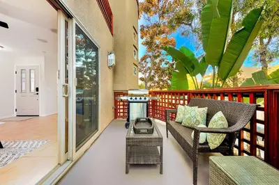 a porch with a chair and a fire pit at Crown Point Views Home in San Diego