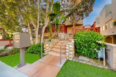 a house with a staircase in a yard at Crown Point Views Home in San Diego