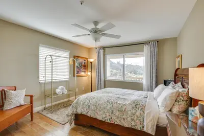 a bedroom with a bed and a window at Hot Tub and Balcony Rainbow Retreat Near Wineries! in Fallbrook