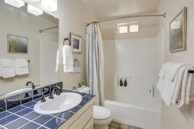 a bathroom with a sink and a toilet and a shower at Hot Tub and Balcony Rainbow Retreat Near Wineries! in Fallbrook