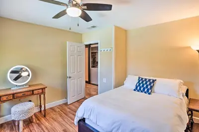 a bedroom with a bed and a ceiling fan at Deluxe Laguna Hills Home with Outdoor Oasis! in Laguna Hills