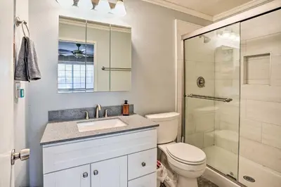 a bathroom with a toilet and a sink and a shower at Deluxe Laguna Hills Home with Outdoor Oasis! in Laguna Hills