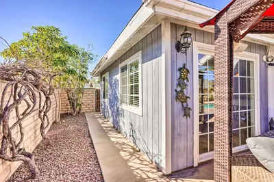 a house with a side walk leading to the front door at Deluxe Laguna Hills Home with Outdoor Oasis! in Laguna Hills