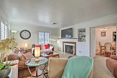 a living room with a couch and a fireplace at Quaint La Mesa Home with Beautiful Sunsets! in La Mesa