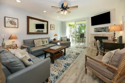 a living room filled with furniture and a fireplace at F100 - Coastal Oasis in Oceanside