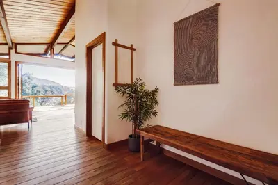 a room with a wooden bench and a plant at Hot tub Disney train track in Julian amazing views in Julian