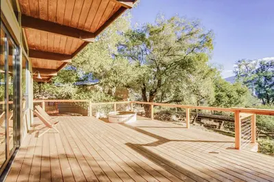 a wooden deck with awning on a house at Hot tub Disney train track in Julian amazing views in Julian