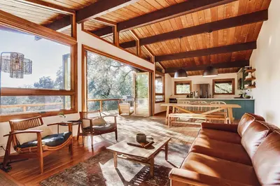 a living room with a couch and a table at Hot tub Disney train track in Julian amazing views in Julian