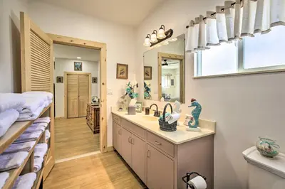 a bathroom with a sink and a mirror at Sunny Bonita Studio about 5 Mi to Historic Dtwn! in Bonita