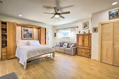 a bedroom with a bed and a ceiling fan at Sunny Bonita Studio about 5 Mi to Historic Dtwn! in Bonita