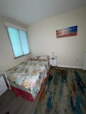 a bedroom with a bed and a window at Resort like stay in a lovely room near UCI in Irvine